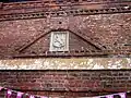 The Old King's Head. Mannerist brick decoration over earlier doorway