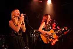 Catherine (left) and Allison Pierce (right) performing in 2012
