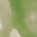 The Red River flood plain. Low-elevation areas are green, while higher elevation regions are tan and white.