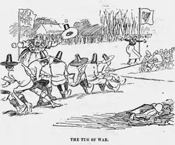Cartoon by J. M. Staniforth depicting the Ireland–Wales rugby game of 18 March 1899 as a tug-of-war; the Welsh team wear Welsh hats.