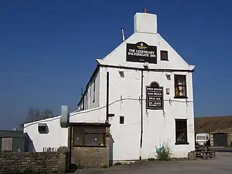 A low angle shot looking upwards at a largely whitewashed building