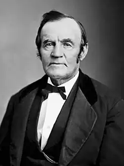 A black-and-white portrait of an old man.