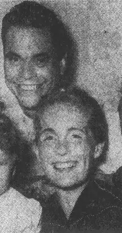Black and white photo of Rockwell standing next to Thora. Both are smiling.