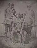 Manuelito, Barboncito, and Navajo boy and man, 1868