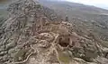 Top of the mountain showing half side of the fortification (Arabic: حِصْن ٱلْغُرَاب, romanized: Hiṣn Al-Ghurāb)