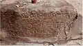 Inscriptions on a mountain in Thuvarankurichi
