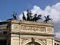 Equestrian figures flanking the Quadriga di Apollo by Mario Rutelli atop Teatro Politeama, Palermo