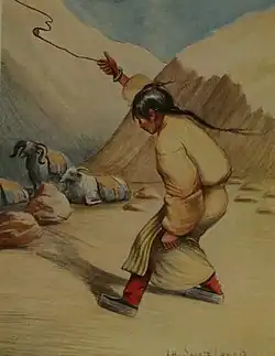 A Tibetan girl guarding a herd of goats slings a small rock.