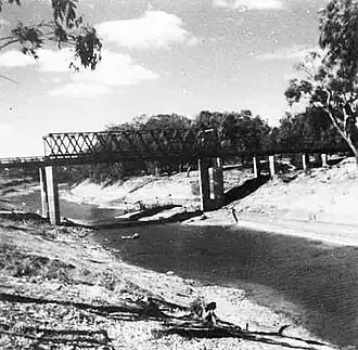 The Darling River at Tilpa c. 1945. The punt can be seen behind the new bridge