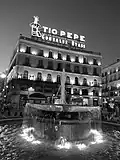 Tío Pepe Neon Advertisement ' Puerta Del Sol ' Madrid, Spain ' photographed at Sunset in black and white.