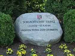 Colour photograph of a grey stone memorial