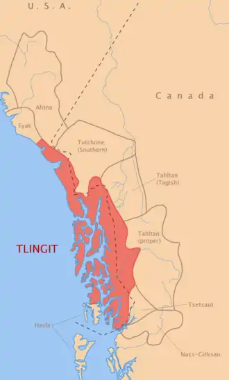 Map showing the traditional territory of the Tlingit people along the Pacific coast of southeastern Alaska and adjacent coastal British Columbia, highlighted in red, with neighboring Indigenous language groups labeled inland and to the south.