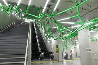Underground passage stairs at Toei Subway Iidabashi Station, equipped with wire-frame lighting.
