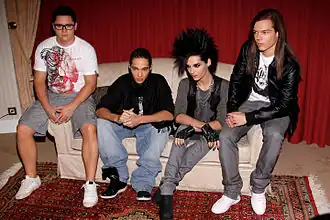 Tokio Hotel in 2009. L–R: Gustav Schäfer, Tom Kaulitz, Bill Kaulitz, and Georg Listing