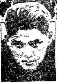 A black and white photograph of a man, shot from the neck up