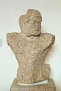 Torso of a statue of Heracles, from older temple of Apollo, c. 570–560 BC.