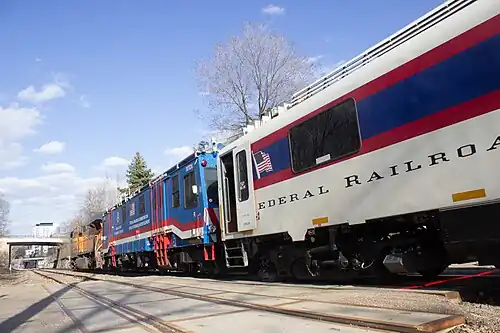 DOTX 218 and DOTX 220 behind a BNSF locomotive