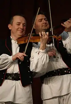 Image 61Traditional Croatian musicians playing violins (from Culture of Croatia)