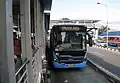 Scania K3210A bus arriving at the station
