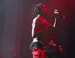 American rapper Travis Scott sagging his pants while performing in 2015