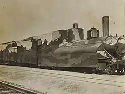 A train painted in camouflage colors