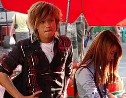 Image 119Teenagers in Yangon, Myanmar with trendy, dyed haircuts and slim fit, layered silhouettes inspired by East Asian and American trends, 2014. (from 2010s in fashion)