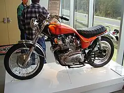 Orange motorcycle in museum