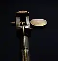 The single tuning peg of a tromba marina, turned by hand