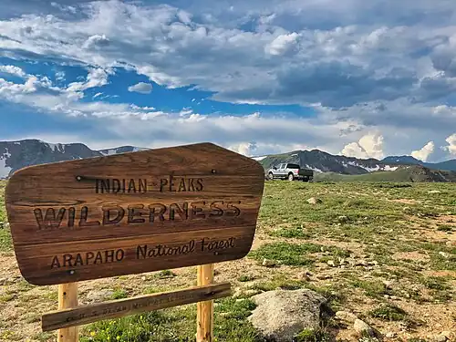 A vehicle has not followed the published Motor Vehicle Use Maps (MVUMs) and has parked inside of the Indian Peaks Wilderness area, where motorized vehicles are prohibited. Fines can be as much as $5,000.[307]