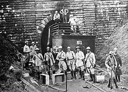 Soldiers in front of a tunnel entrance
