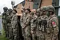 Turkish, Latvian, British and Italian medical personnel pose for a photo at a static display of equipment during NATO Exercise Steadfast Defender 2021