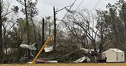 Trees are downed and sheet metal is strewn around after a tornado moved through areas near Kentwood, Louisiana and caused EF0-EF1 damage.