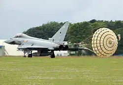 RAF Typhoon using a drogue parachute for braking after landing.