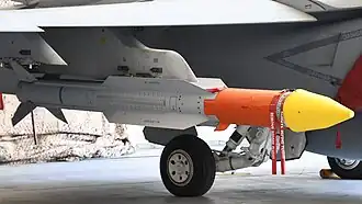 Image of AIM-174 missile mounted underwing on a Super Hornet