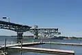 USS Arleigh Burke traveling under the bridge.