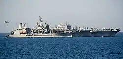 Joshua Humphreys steams alongside the carrier, George Bush, 9 July 2014