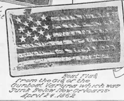 An American flag with 13 stripes and 13 stars. Text under the flag reads: "Boat Flag from the Gig of the Gunboat Varuna which was Sunk Below New Orleans April 24, 1862"