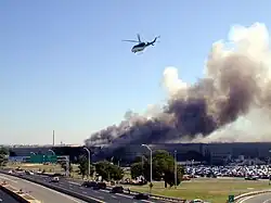 Image 73The Pentagon following the September 11 attacks with the Washington Monument visible in the background (from History of Washington, D.C.)