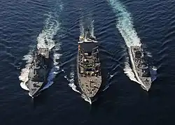 JS Ikazuchi and JS&nbsp;Kongō replenish with USNS&nbsp;Tippecanoe on 5 December 2010.