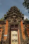 Richly decorated Indonesian Balinese temple gate called Paduraksa