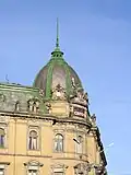 Building dome with a spire and the allegorical sculpture "Oshchadnist"