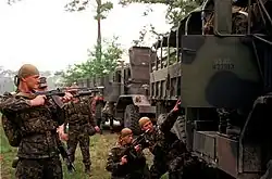 Ukrainian army soldiers wearing bandanas during a military exercise