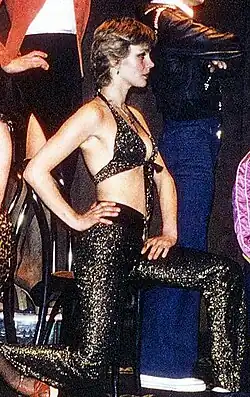 Image 80Swedish model Ulla Jones dressed in a lurex halter top and matching flared trousers (from 1970s in fashion)