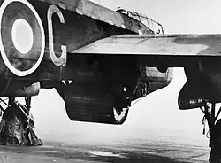 Upkeep bouncing bomb in position in the bomb bay of Guy Gibson's Lancaster – serial ED932/G, code 'AJ-G'