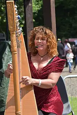 Ursula Burns playing harp.