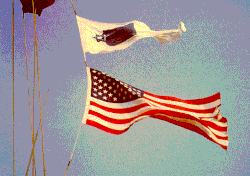 A worship pennant flying above the National Ensign (American flag) on a US Navy ship[94]