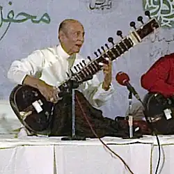 Khan performing in 2013