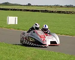 VMCC Festival of Jurby/Manx Grand Prix 2012 Demonstration lap by Isle of Man TT & Manx Grand Prix winners Michael Dunlop and Dan Sayle Sunday 26 August 2012