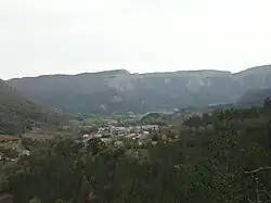 The village of Valbelle nestled in the valley, and the cirque