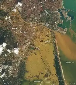 Satellite image of flooding in the Land of Valencia showing the Poyo avenue and the Turia river